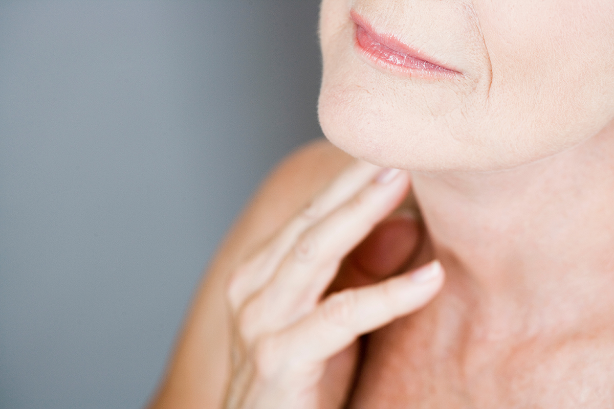 Canva Senior Woman Touching Her Neck
